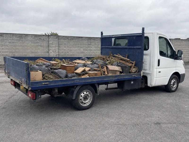 A 3.5-tonne tipper truck loaded to about half of its capacity.